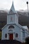 The blue church in the small town of Seydisfjordur on the lake shore in the west of Iceland