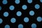 Blue circles on black background texture