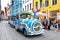 Blue City Train, tourist sightseeing vehicle, is driven through Pikk Steet in the Old Town of Tallinn, Estonia