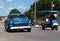 A blue classic car drived on the street