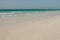 Blue clear sea, yacht, water, waves, clear sky. beach in Saadiyat island, United Arab Emirates. Beautiful seascape