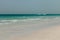 Blue clear sea, yacht, water, waves, clear sky. beach in Saadiyat island, United Arab Emirates. Beautiful seascape