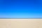 A blue clear sky with beach and ocean