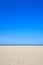 A blue clear sky with beach and ocean