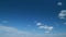 Blue clear sky with white stratocumulus and cumulus clouds background. Light white cumulus clouds in blue sky on a