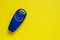 Blue clicker, special appliance for dog training, on positive motivation