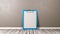 Blue Clipboard with Blank Paper Against Wall