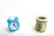 blue clock and dollars on a white background. the concept of `time is money`. business financial ideas. saving. Financial investme