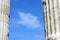 Blue clouded sky between two ancient Greek columns
