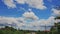 Blue Cloudy Sky over Traffic Road among Country Houses