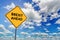 Blue cloudy sky and yellow road sign