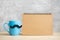 Blue coffee cup or tea mug with Black mustache decor and empty paper notepad or calendar on table. Blank copy space for text. Blue