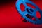 Blue cogwheel on a red background