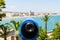 Blue Coin Operated Telescope Of Panoramic Tropical City And Ocean