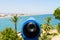 Blue Coin Operated Telescope Of Panoramic Tropical City And Ocean