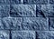 Blue color stylized brick wall pattern.