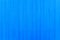 Blue Color Texture. Blue plywood surface. Abstract concept for the background. Vertical lines of plywood are painted blue througho