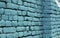 Blue colored brick wall background texture