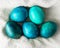 Blue colored Easter eggs in white napkin