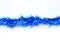 Blue colors bunch fur or Christmas tree tinsel garland on white background. Christmas and New year celebration