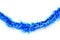 Blue colors bunch fur or Christmas tree tinsel garland on white background. Christmas and New year celebration