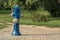 Blue column with water in the middle of the park.