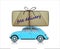 Blue compact car with free delivery parcel