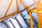 Blue construction respirator U-2K half mask hanging on scaffolding close-up against the background of an uninsulated roof, bottom