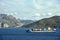 Blue container ship sailing near Spanish port, Ceuta.