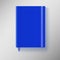 Blue copybook with elastic band and bookmark.