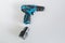 A blue cordless drill with battery pack for worker