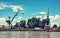 Blue cranes in cargo port, Danube river, retro photo filter