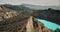 Blue crater lake on volcanic mountain. Aerial wild nature landscape. Azure turquoise water reservoir