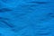 Blue creased crepe paper background texture
