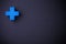 Blue cross cube on blackboard
