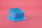 Blue cube melting on pink background. 3d illustration