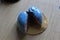 Blue cupcake cut in half. Chocolate figurine decorates it