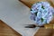 Blue cupcake design cream like blue Hydrangea flower Served on wooden tray with brown paper napkin and little fork
