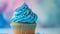 blue cupcake with icing. Close up product shot.
