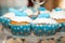 Blue cupcakes decorated with glassed sugar