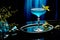 Blue Curacao cocktail garnished with lemon slice, in the style of bold color field