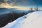 Blue daybreak, thawing of snow. Sandstone cliff misty valley