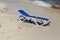 Blue deckchair on the wet sand at the beach