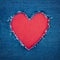 Blue denim background with red heart