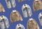 Blue denim casual jacket and corduroy jacket pattern. A selection of different jackets on hangers isolated on blue background. Win