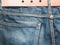 Blue denim jeans with lether belt