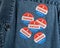 Blue denim working clothing with many Voted stickers