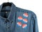 Blue denim working clothing with many Voted stickers on white background