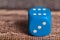 Blue dice on table.Social game