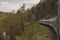 Blue diesel locomotive and blue passenger coach near Jihlava town